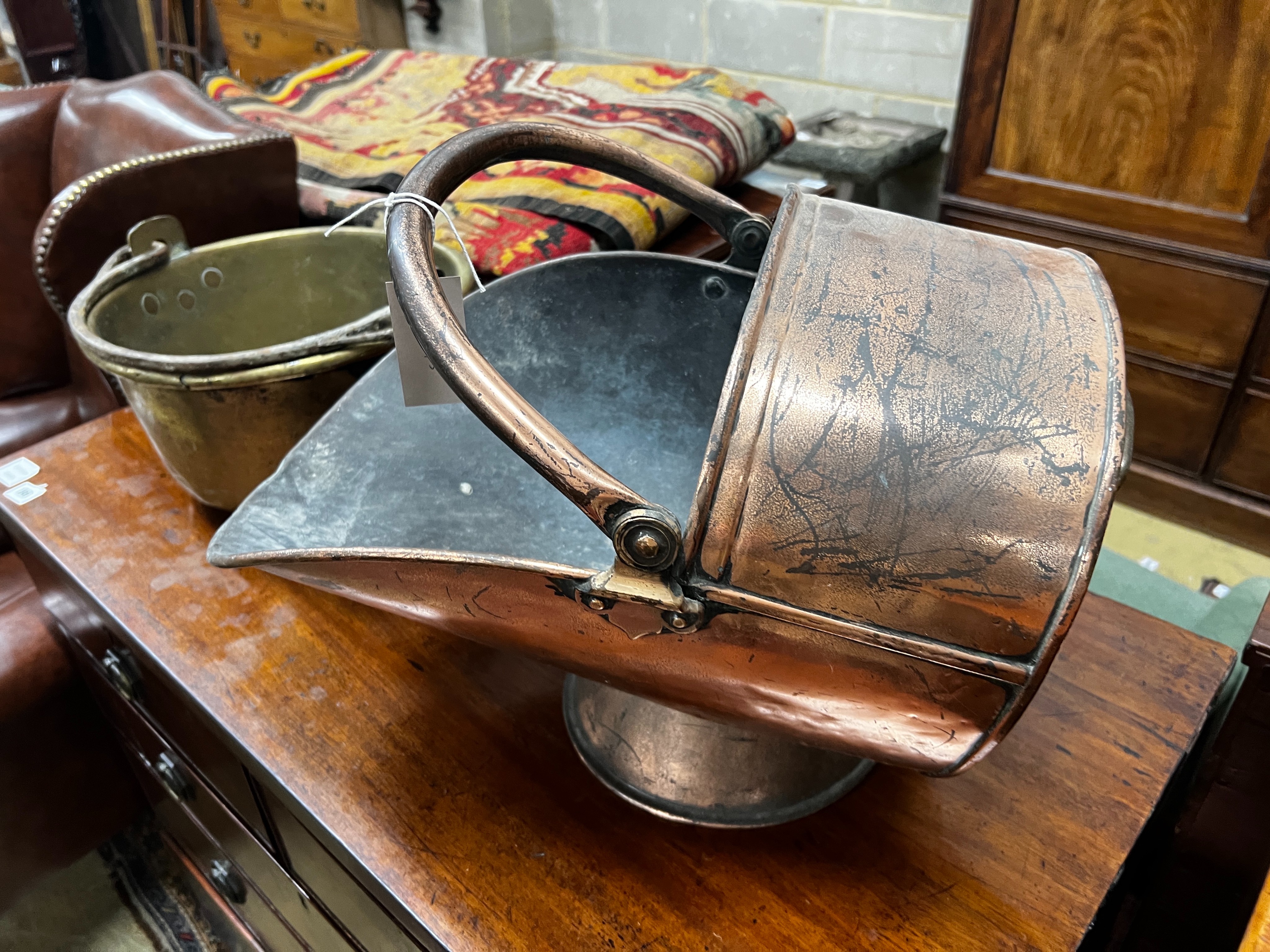 A Victorian copper coal scuttle and a brass preserving pan